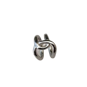 Minimalist silver interlocking double band ring with a polished metallic finish on white