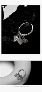 Detail of S925 sterling silver ring with hammer texture and square pendants