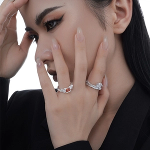 Artistic S925 sterling silver rings with orange and white zircon on a model hand
