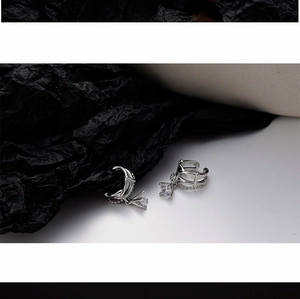 Detailed macro view of S925 sterling silver chain ear cuffs with square zircon drop