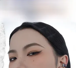Detailed view of black ear cuff with square purple zircon and waterdrop stones