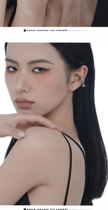Close-up of S925 silver irregular hollow chain ear cuff with a geometric triangle charm