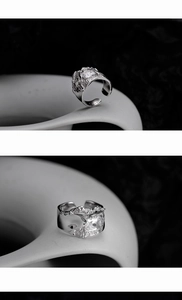 Macro detail of S925 sterling silver ring with irregular texture and square zircon