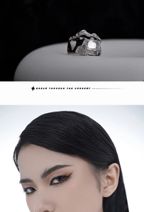 Detail of S925 silver ring featuring liquid metal texture and rectangular zircon stone