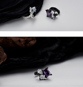 Detailed close-up of textured S925 silver ear cuffs with sparkling multicolor gemstones