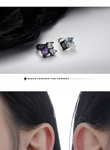 Close-up of S925 silver ear clips with irregular colorful zircons in black gold finish