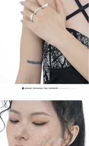 Detail of silver irregular lava texture rings with minimalist open design on model