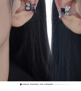 Close-up of S925 sterling silver ear cuffs with colorful heart and square gemstones