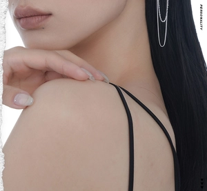 Close-up of S925 sterling silver long chain ear cuff with sparkling textured accents