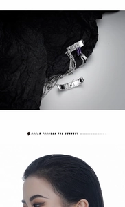 Detail of S925 silver fringe earring with purple gemstone and asymmetric long chain