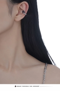 Close-up of S925 sterling silver ear cuff with deep purple square gemstone and micro-diamonds