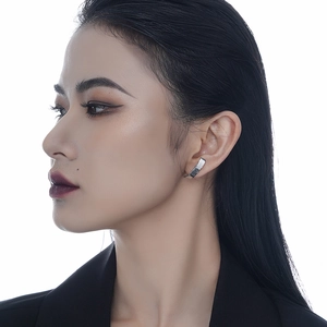 Polished S925 sterling silver ear cuff with minimalist wide band design on model