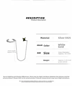 Detail view of S925 sterling silver ear cuff with green gemstone and hanging chain