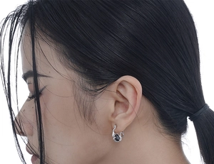 Close-up of S925 silver irregular earrings with embedded black oval zirconia stone