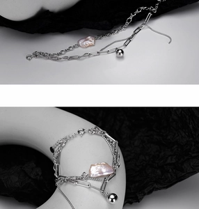 Detail of 925 silver bracelet with multi-layered chains and baroque purple pearl