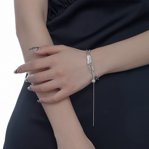 Baroque pearl bracelet in 925 sterling silver with ball charms and long tassel chain