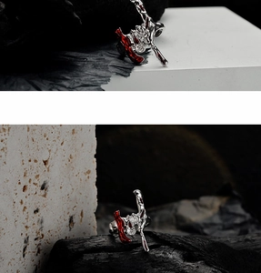 Macro detail of irregular S925 silver ring with red enamel in liquid metal style