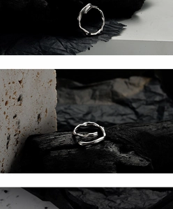 Detailed macro view of an irregular lava texture S925 silver ring with an open adjustable band
