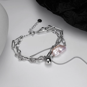 S925 sterling silver multi-layer chain bracelet featuring a large baroque pink pearl