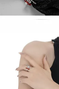 Macro detail and model view of S925 silver irregular ring with red enamel and zircon