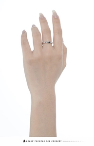 Detail of S925 sterling silver ring featuring an irregular textured surface and black glaze