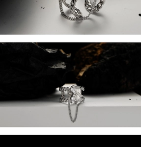Detail view of S925 sterling silver chain ring with zircons and hanging tassel detail
