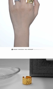 Detailed view of hammered texture rings in gold and silver with modern artisan finish