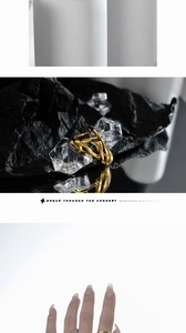 Detail of irregular molten lava design gold ring with unique artistic flowing texture