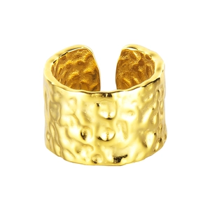 Minimalist hammered gold open ring featuring a wide band and irregular textured finish