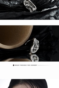 Detail of silver irregular lava texture ring with Break Through The Current engraving