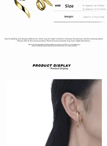 Macro view showing asymmetrical twisted golden curve earrings with precise dimensions