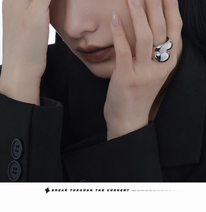 Close-up of S925 sterling silver geometric thick wrap ring on model with polished finish