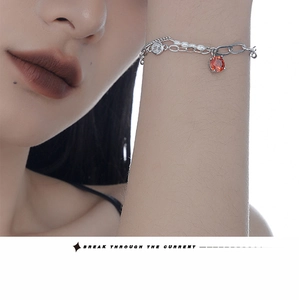 Detail of S925 silver double-layer bracelet with baroque pearls and red gemstone
