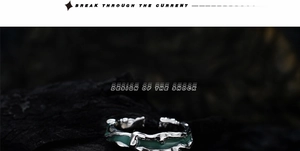 Close-up of S925 silver irregular enamel ring with teal resin on dark rock base