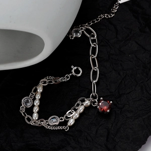 Baroque pearl bracelet with S925 silver chain and deep red gemstone centerpiece