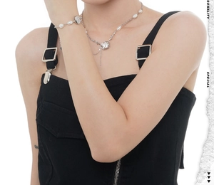 Detail of S925 silver baroque pearl necklace and bracelet set on a female model