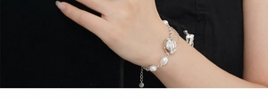 Detail of S925 sterling silver baroque pearl bracelet worn on wrist with adjustable chain