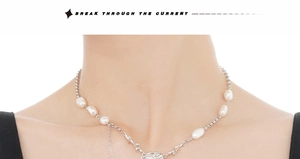 Detailed shot of square baroque pearl pendant with unique silver branch chain design