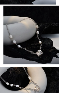 Detailed macro of a baroque pearl pendant featuring molten silver lava wrap craftsmanship