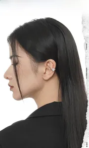Detailed view of teardrop zircon ear cuff in S925 sterling silver on model's ear