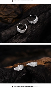 Detail of S925 silver ear cuffs featuring micro-paved zircons and lava texture details