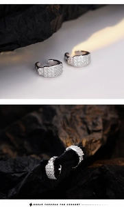 Detailed macro view of S925 silver ear cuffs featuring pave-set rows of sparkling crystals