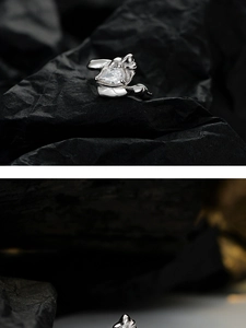 Detailed close-up of textured S925 sterling silver ear cuff with pear-shaped zircon