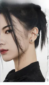 Detail of S925 silver bamboo ear cuff set with green aventurine bead on model