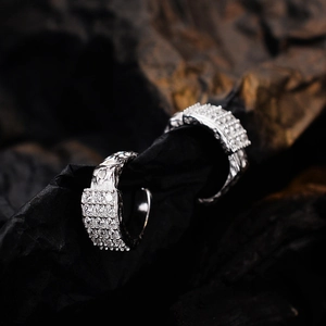 S925 sterling silver micro-pave zircon ear cuffs with handcrafted texture on dark rock