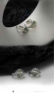 Macro view of textured S925 sterling silver ear cuffs with green aventurine beads
