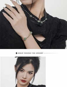 Détail du collier bambou en argent S925 avec aventurine verte sur un qipao noir chic