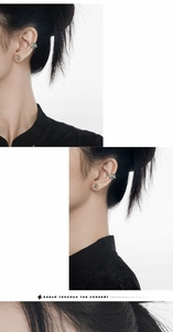 Detail of silver bamboo textured ear cuff and green aventurine stud earring on model
