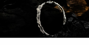 Detailed view of S925 silver ring with organic branch texture and white agate gemstone