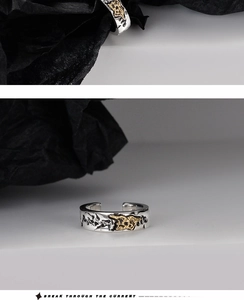 Macro detail of S925 silver adjustable ring featuring vintage embossed gold texture